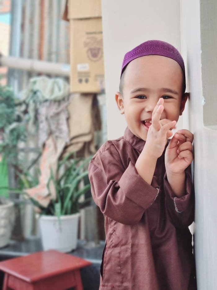 A Boy in Brown Long Sleeve Shirt